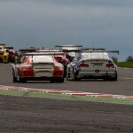 The cars pass through turn 1 at Silverstone. (Photo Courtesy of View Photographic)
